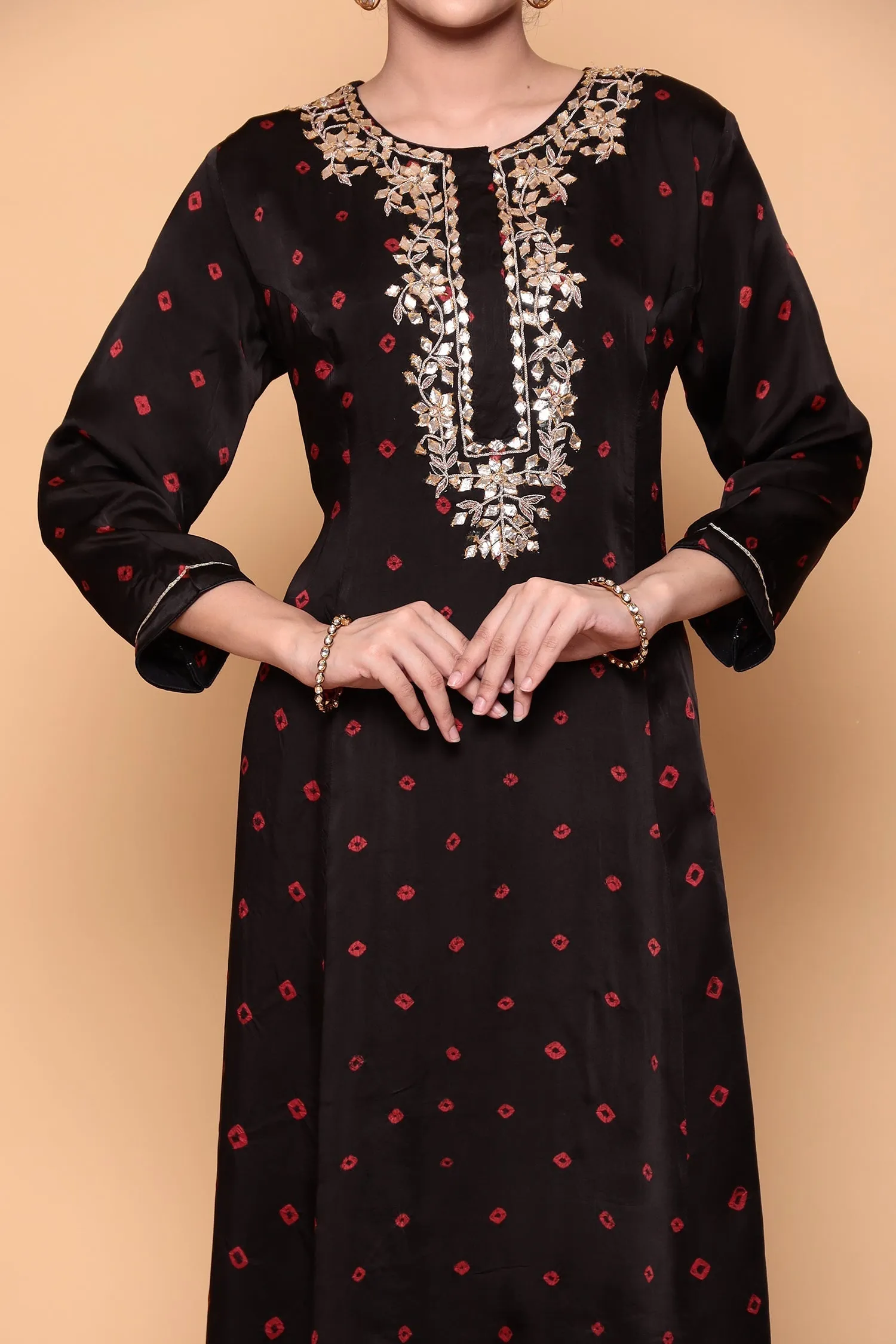 Asymmetric Bandhej Silk Suit with Gota work.