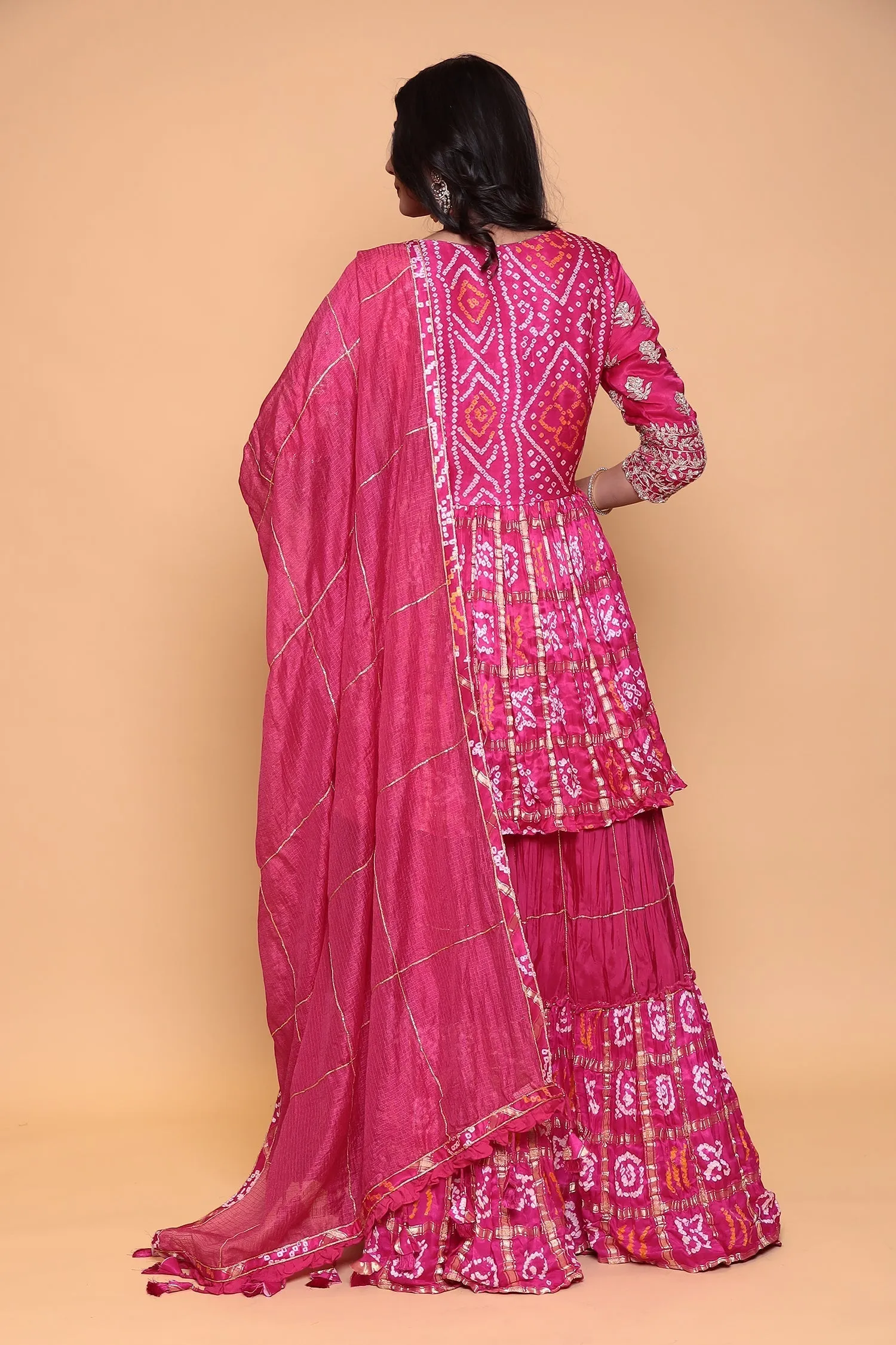 Bandhej ghatchola peplum kurta with skirt and zardozi embroidery.